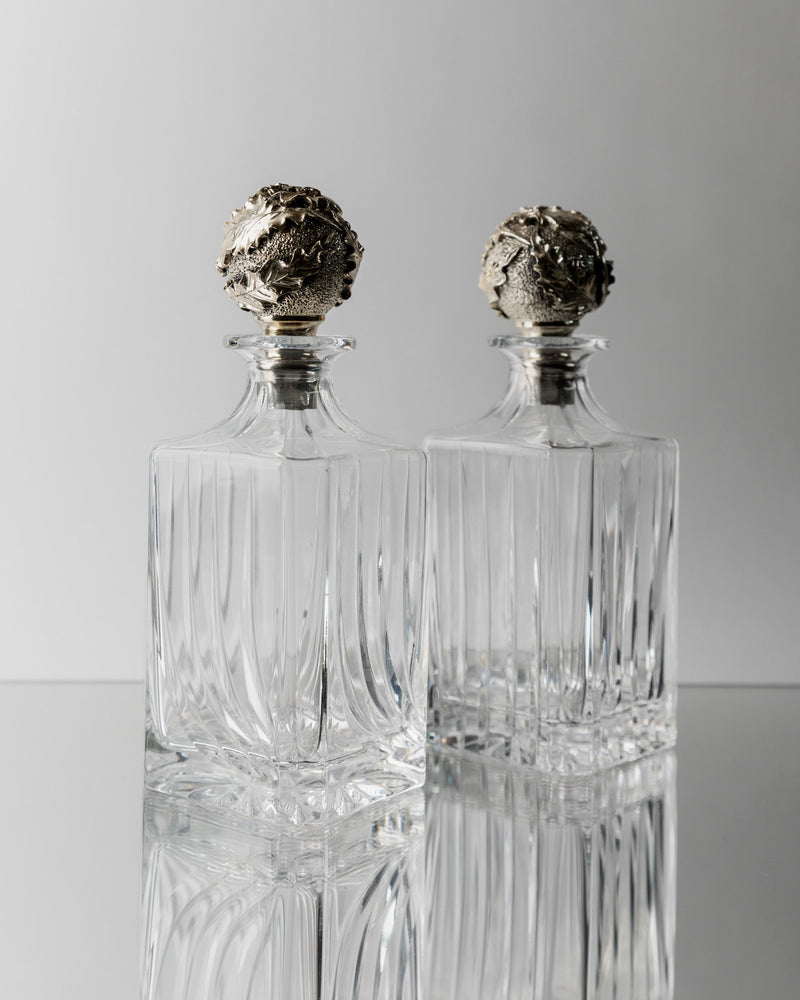 Pair of vintage crystal decanters with ornate silver stoppers 1950s