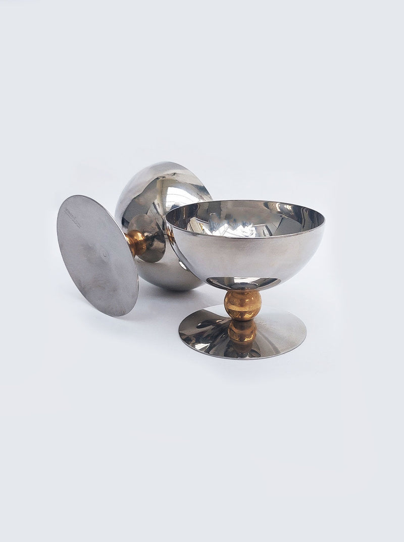 Four ice cream sundae cups with decorative patterns and smooth finish