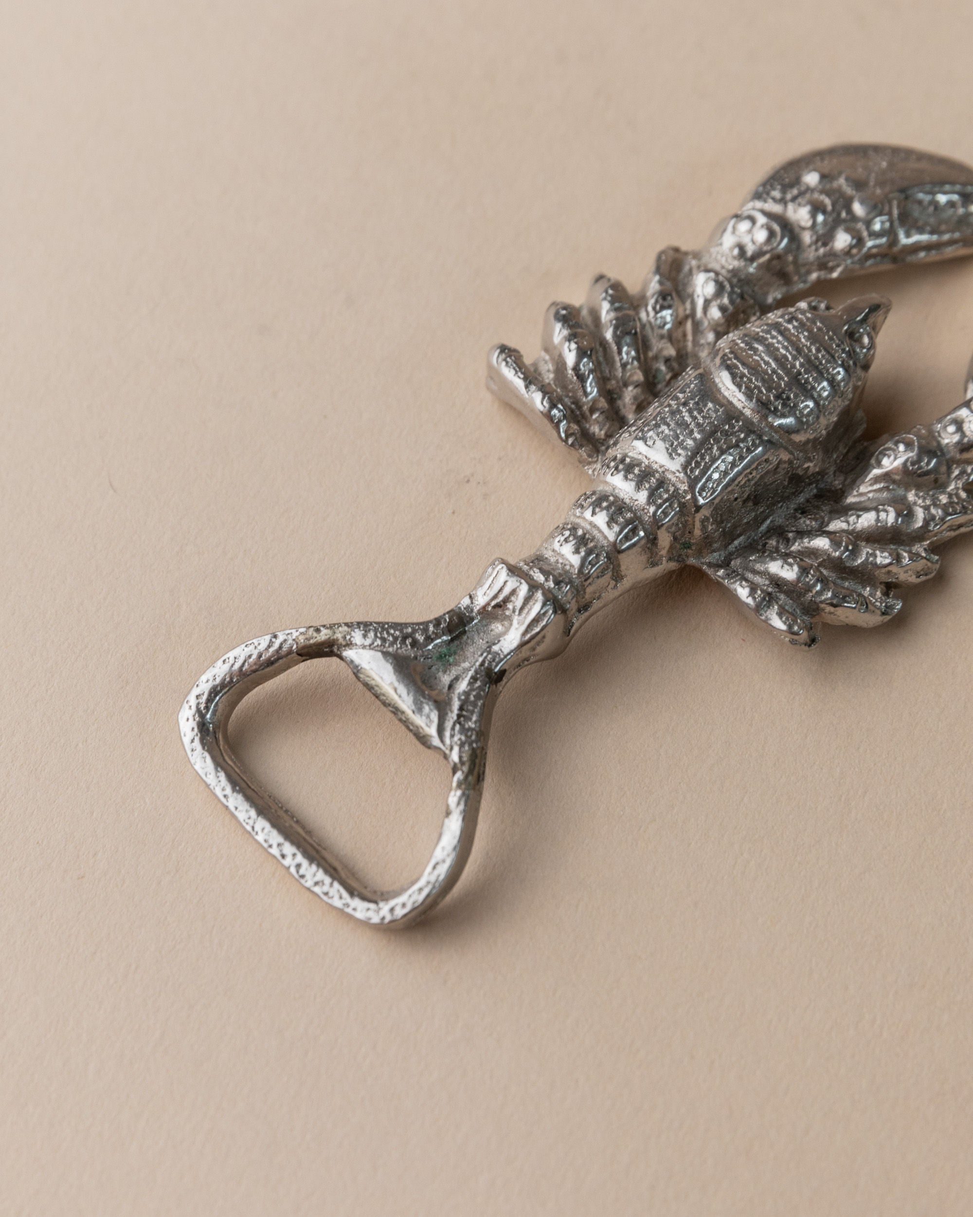 Silver plated pineapple bottle opener detail showing ornate design