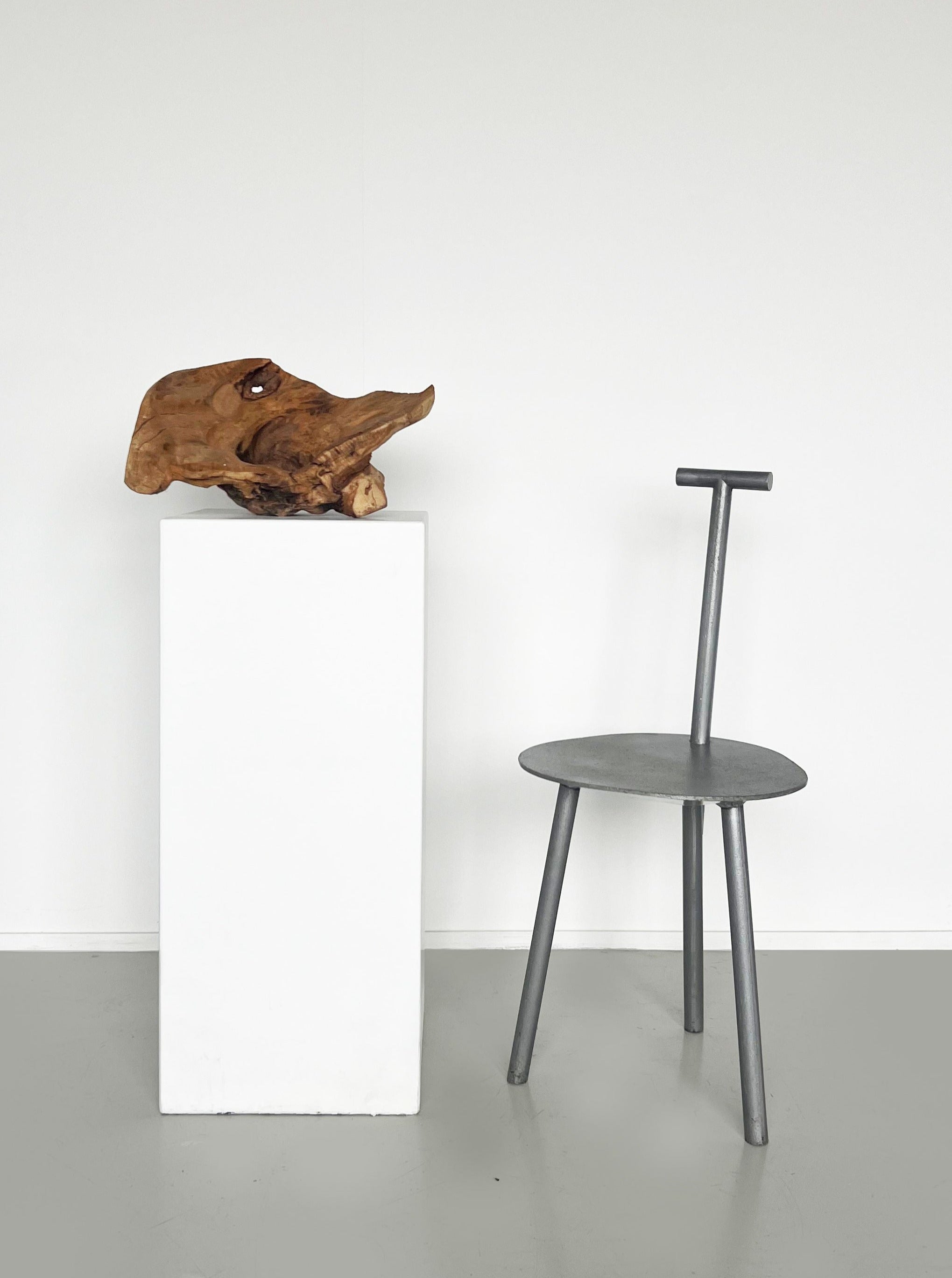 Faye Toogood Spade Chair, a modern and sleek design with geometric lines and comfortable seat 