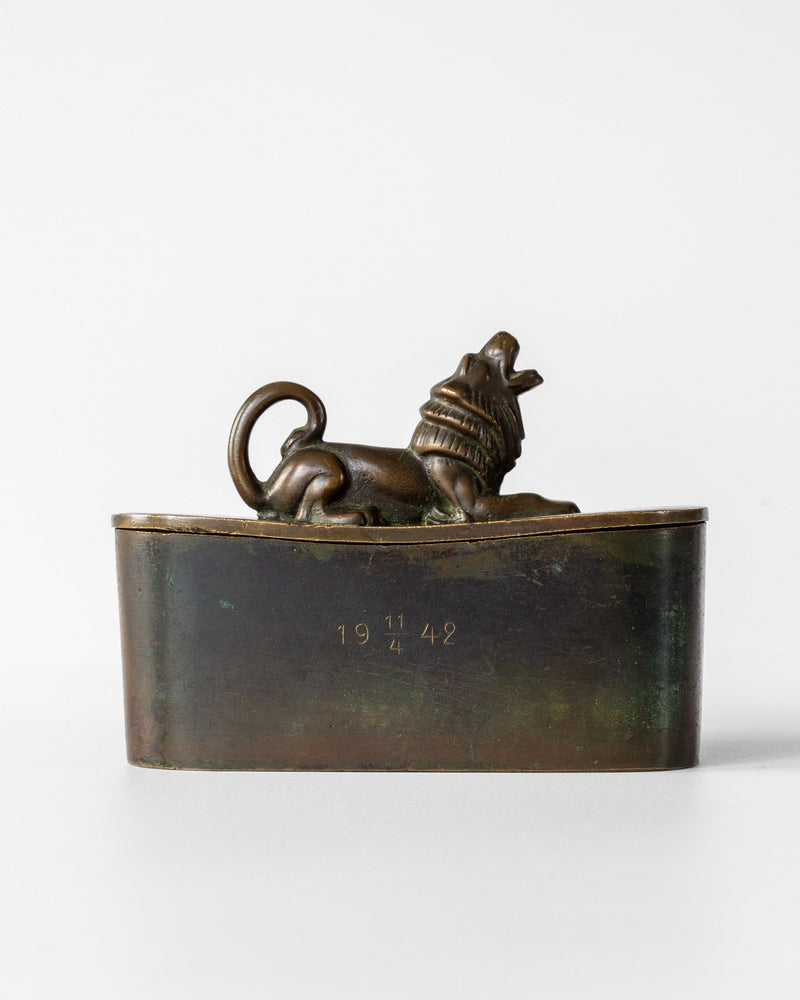 Art Deco bronze box with reclining lion finial, dated 1942