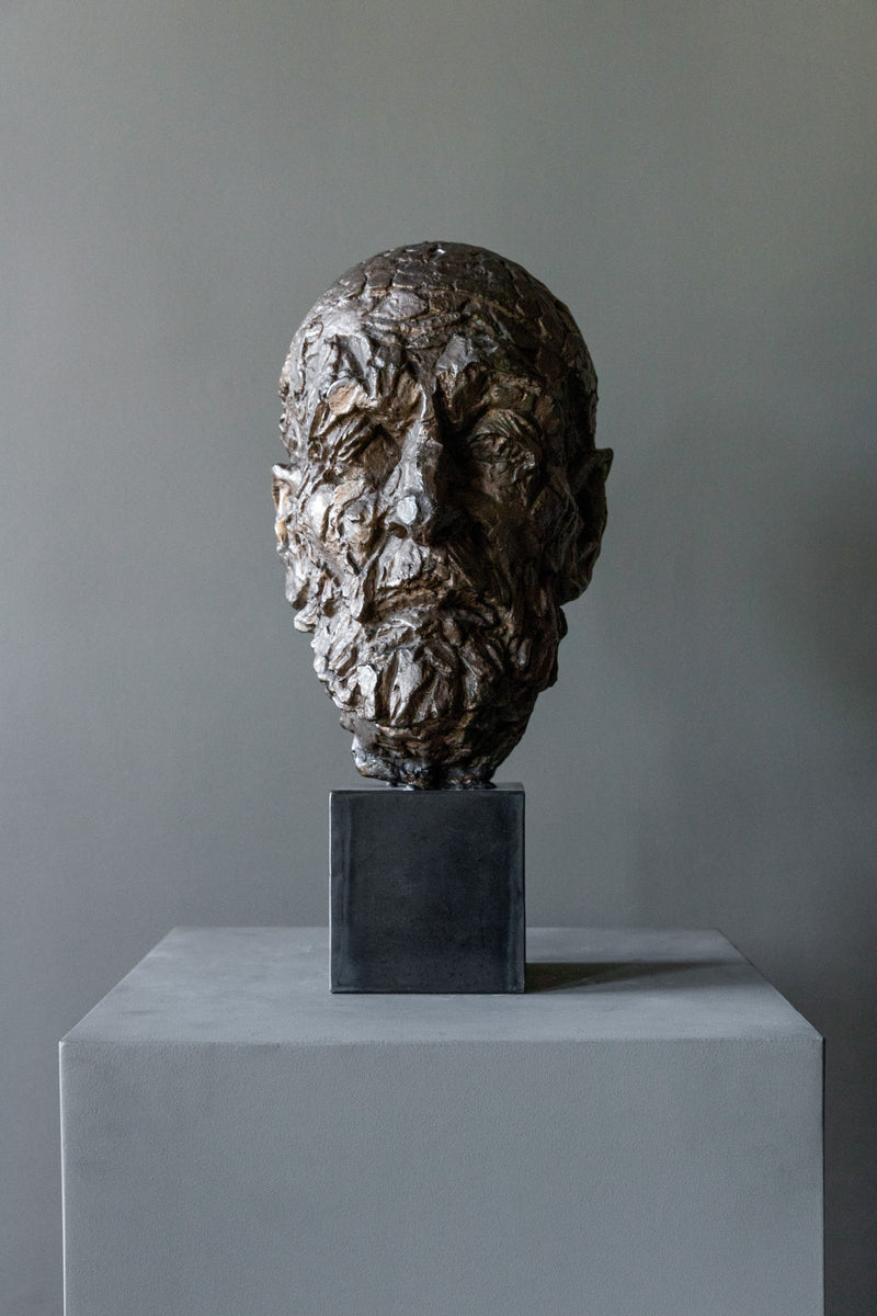 Vintage Bronze Sculpture 60s — close-up of textured bronze face on pedestal