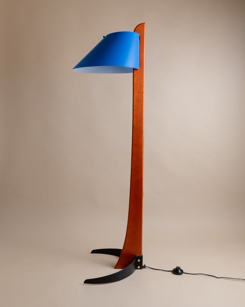 Blue lampshade and orange wooden pole detail of Pinocchio floor lamp