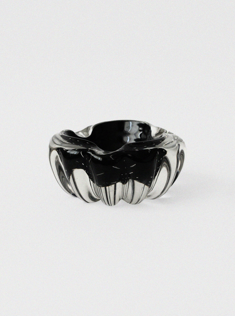 Scalloped crystal glass ashtray showing ribbed exterior detail