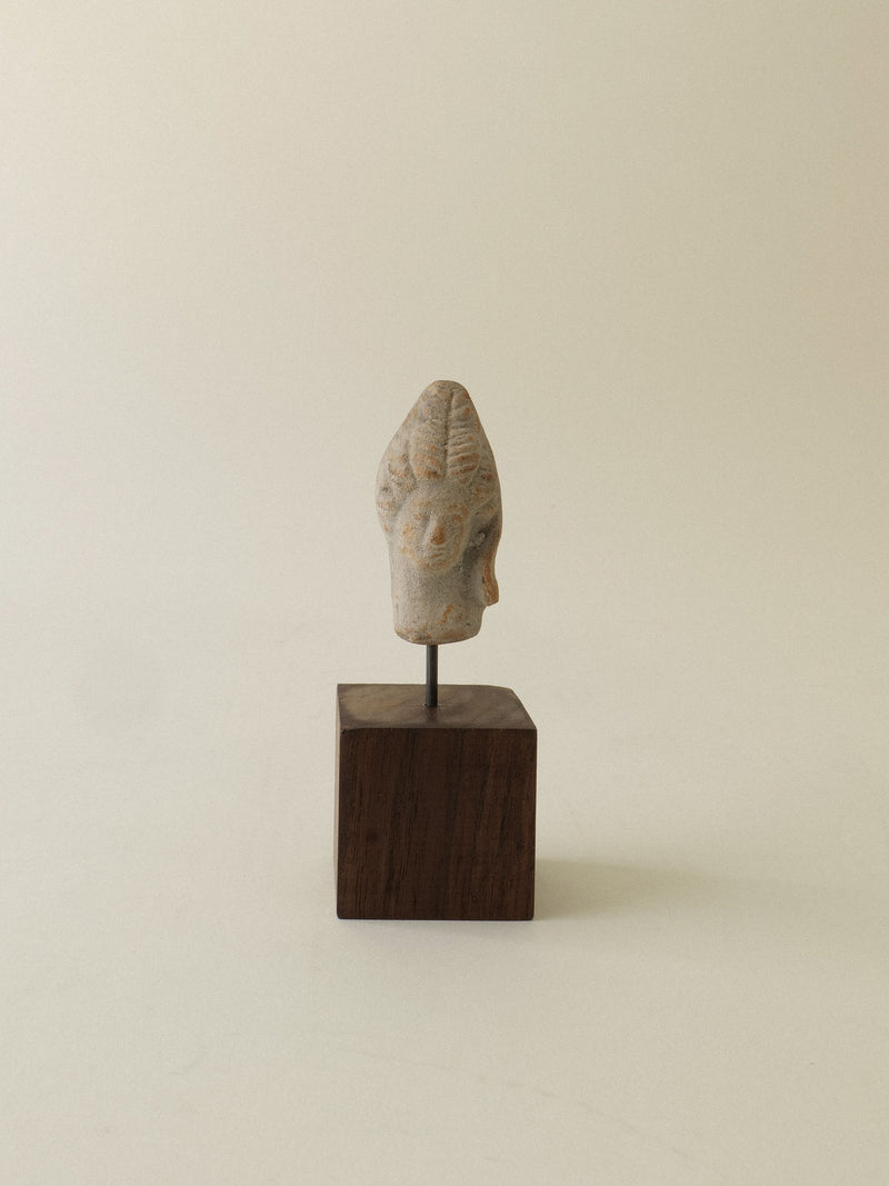 Ancient Hera sculpture head in weathered stone on wood base