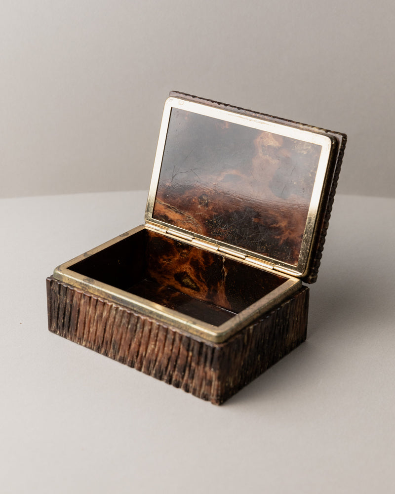 The Alabaster Box by Bottega Jacobs, Italy 1970s, is a small rectangular decorative box with a hinged lid, brown textured exterior, metallic edge trim, and a dark glossy interior visible when open.