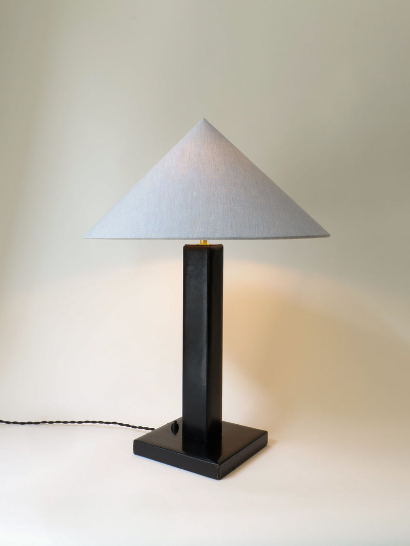 Adnet leather table lamp with triangular shade, side view