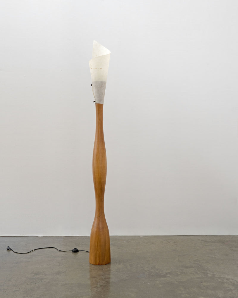 Tall sculptural wood floor lamp with white fabric shade by Tom Bogle