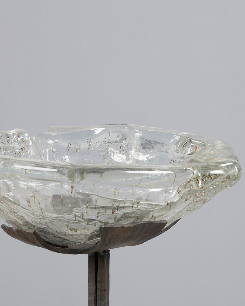 Brutalist iron candle stand with clear glass bowl detail