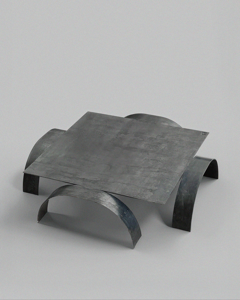 YUMI coffee table sculptural curved steel legs detail view