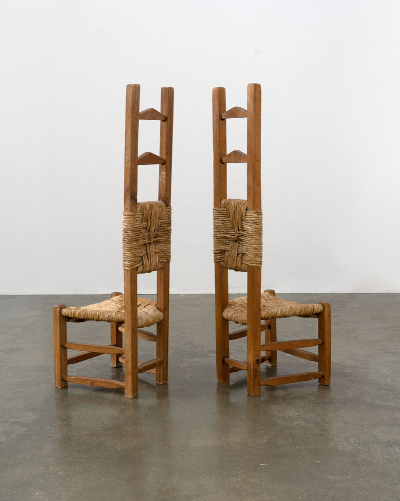 Two Chilean pine rush seat chairs with extended tall ladder backs