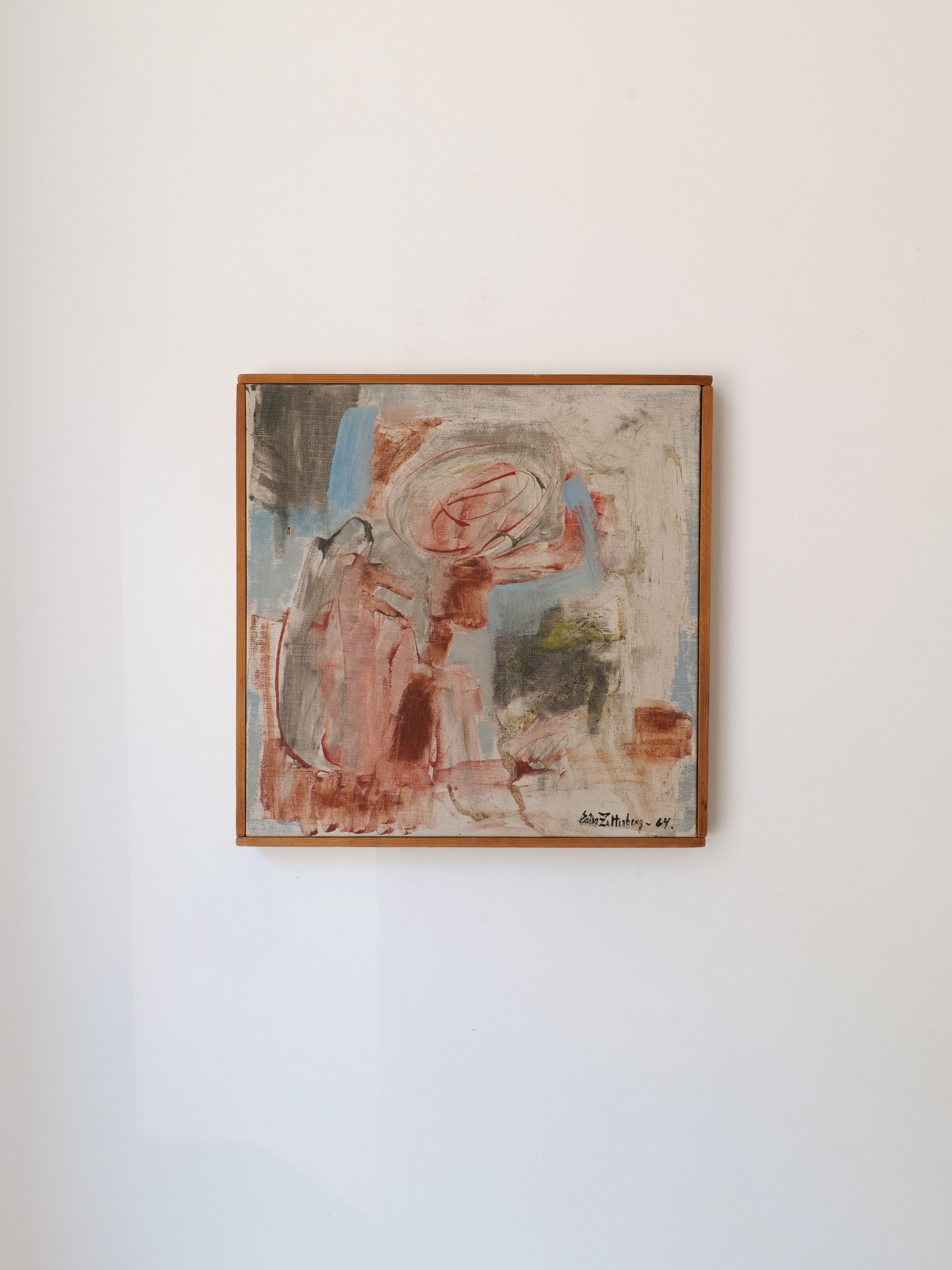 Summer" by Swedish artist Ester Zetterberg, part of the Collection apart brand, is an abstract painting from the 1960s featuring swirling brushstrokes in muted red, blue, gray, and beige tones. Displayed in a wooden frame on a white wall.