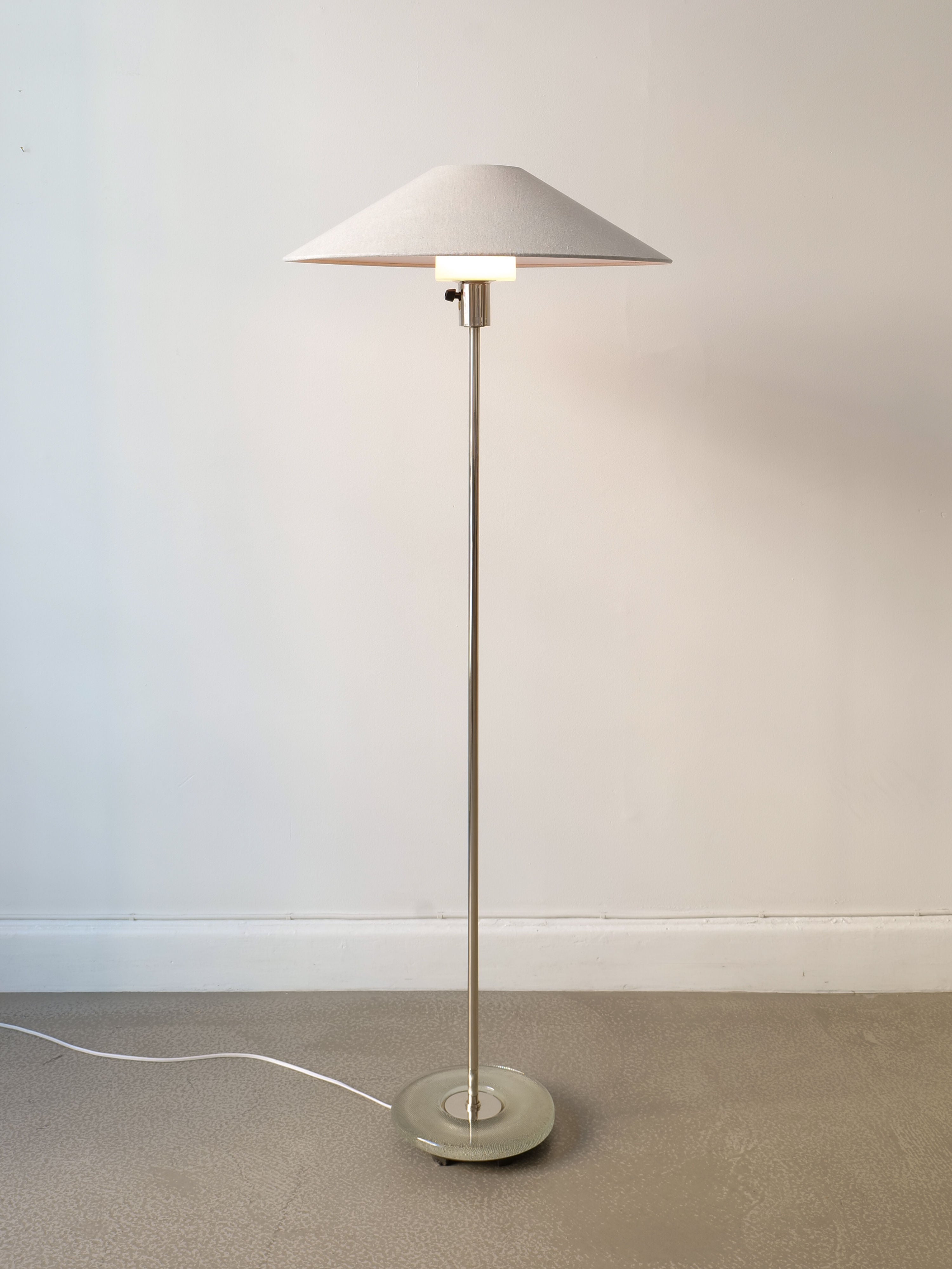 A Deco Floor Lamp Harald Notini 1940s graces the room, showcasing Swedish Modern design and exceptional craftsmanship from Collection apart.