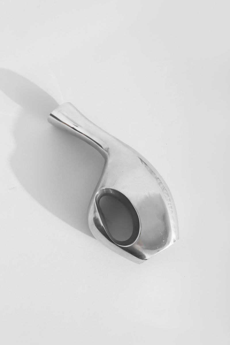 Modern chrome sculptural vase with curved organic form