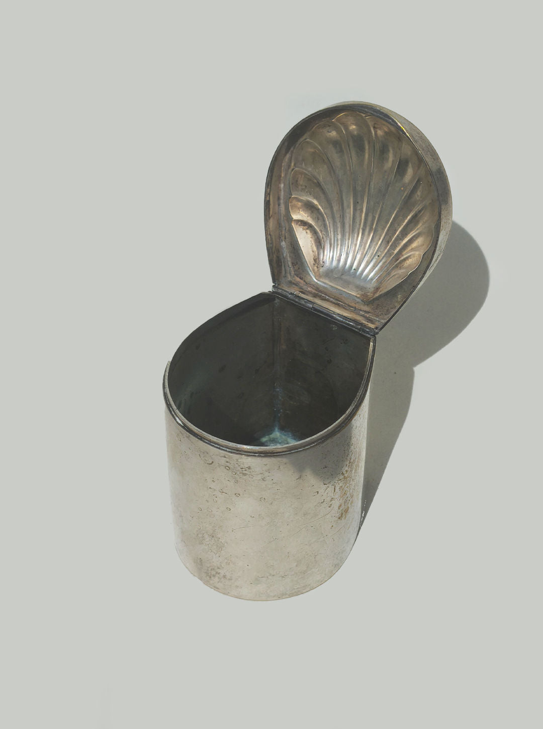 Silver-plated shell box with scalloped lid shown open