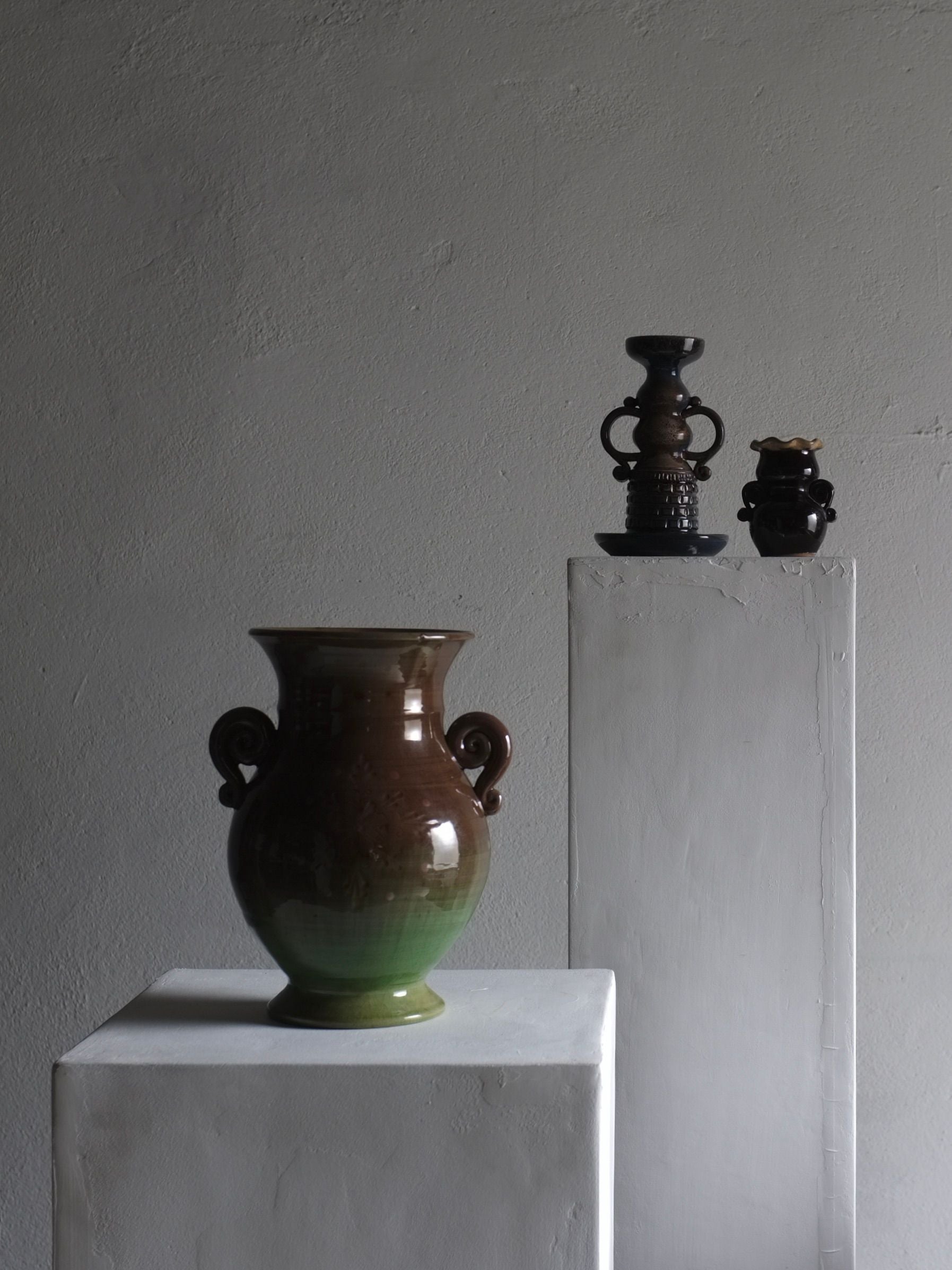 Large Green Ceramic Vase, Latvia, 1960s — close-up of vase on white pedestal