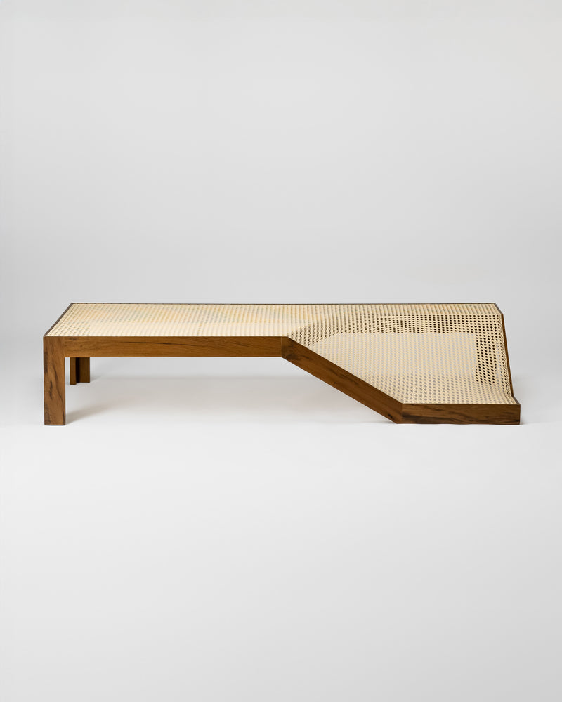 Modern walnut and cane center table with geometric L-shaped design