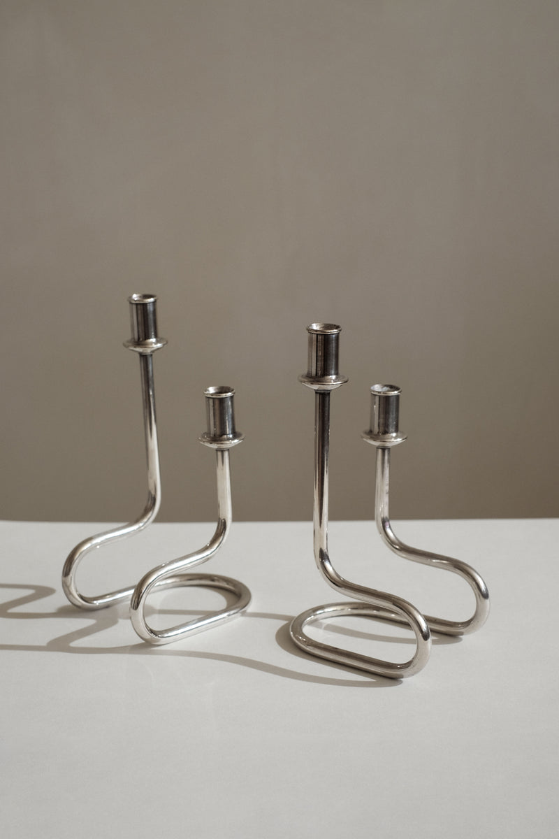 Modern chrome candleholders with curved serpentine stems by Gorham