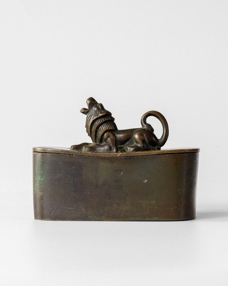 Art Deco bronze box with sculptural lion finial lid