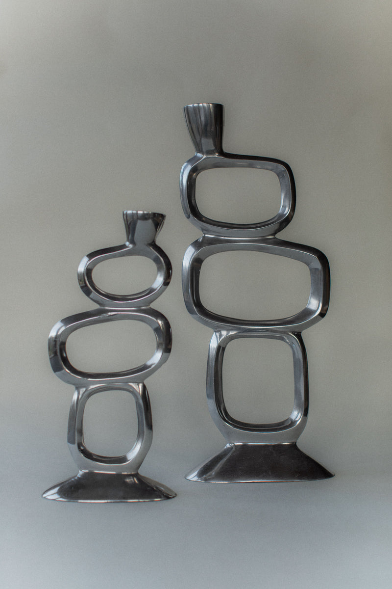 Pair of chrome brutalist candleholders stacked geometric design