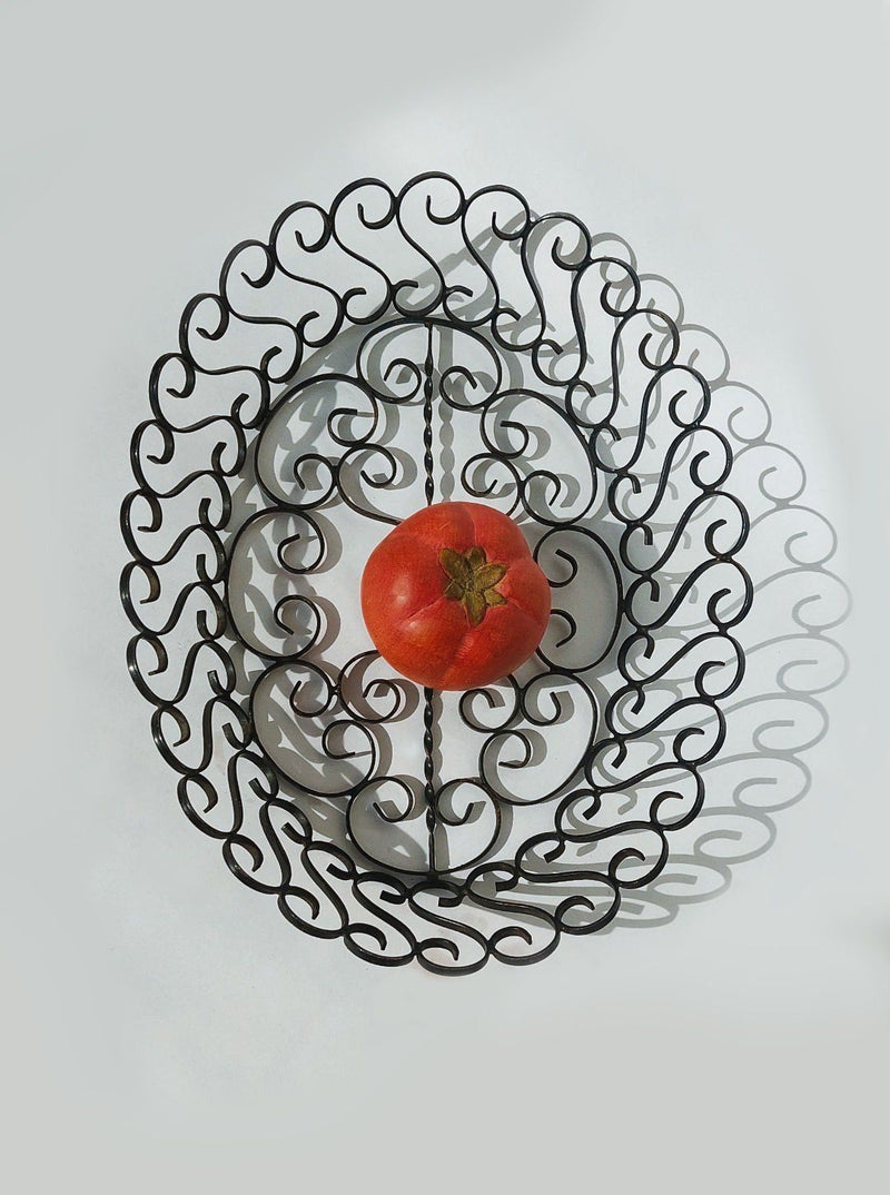 1950s wrought iron decorative basket with ornate scrollwork pattern