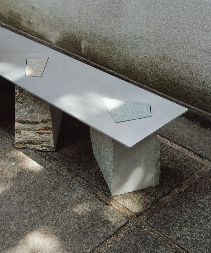Fragments Milano bench detail view showing white surface with geometric inserts
