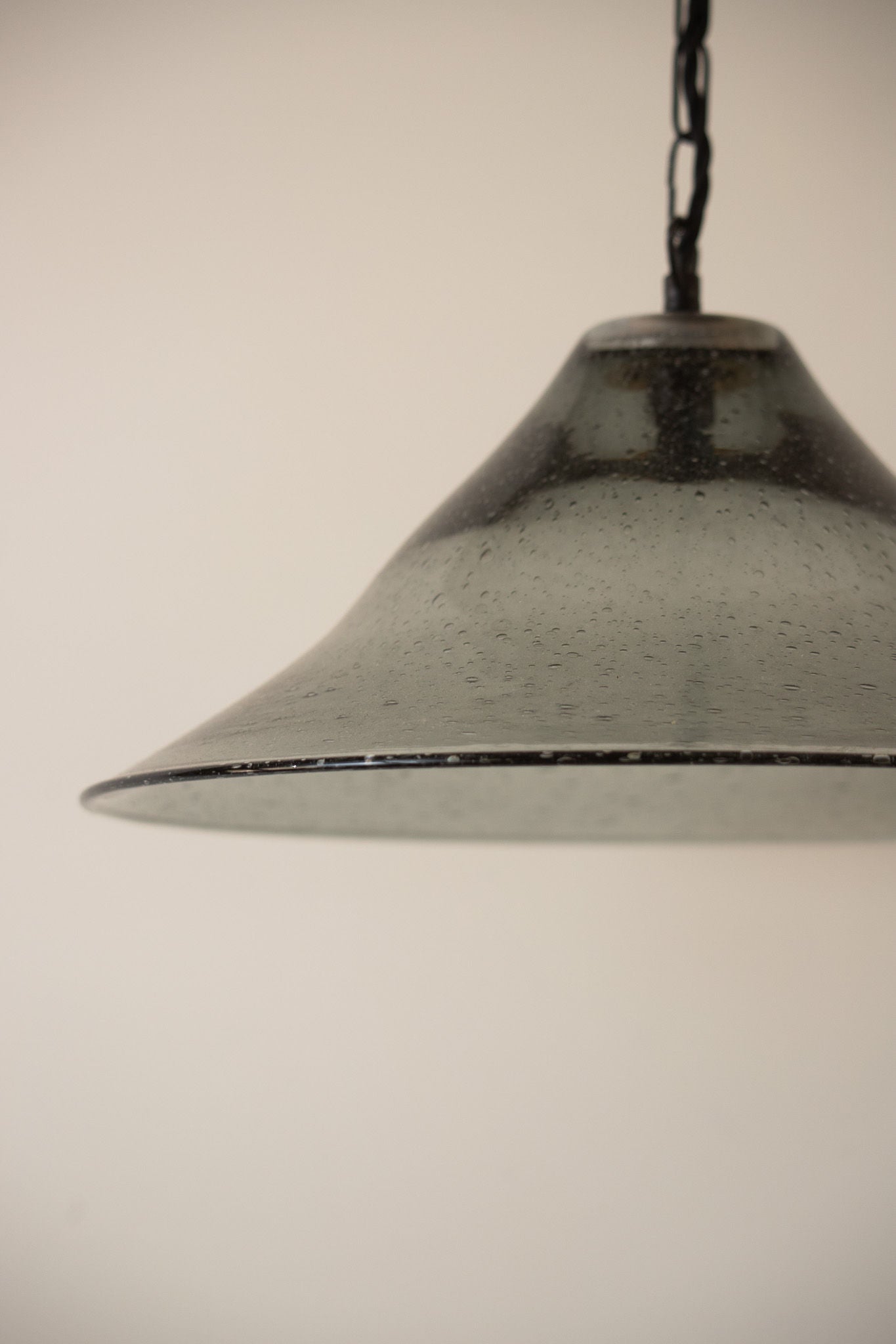 Seeded glass bell pendant with water droplet texture detail
