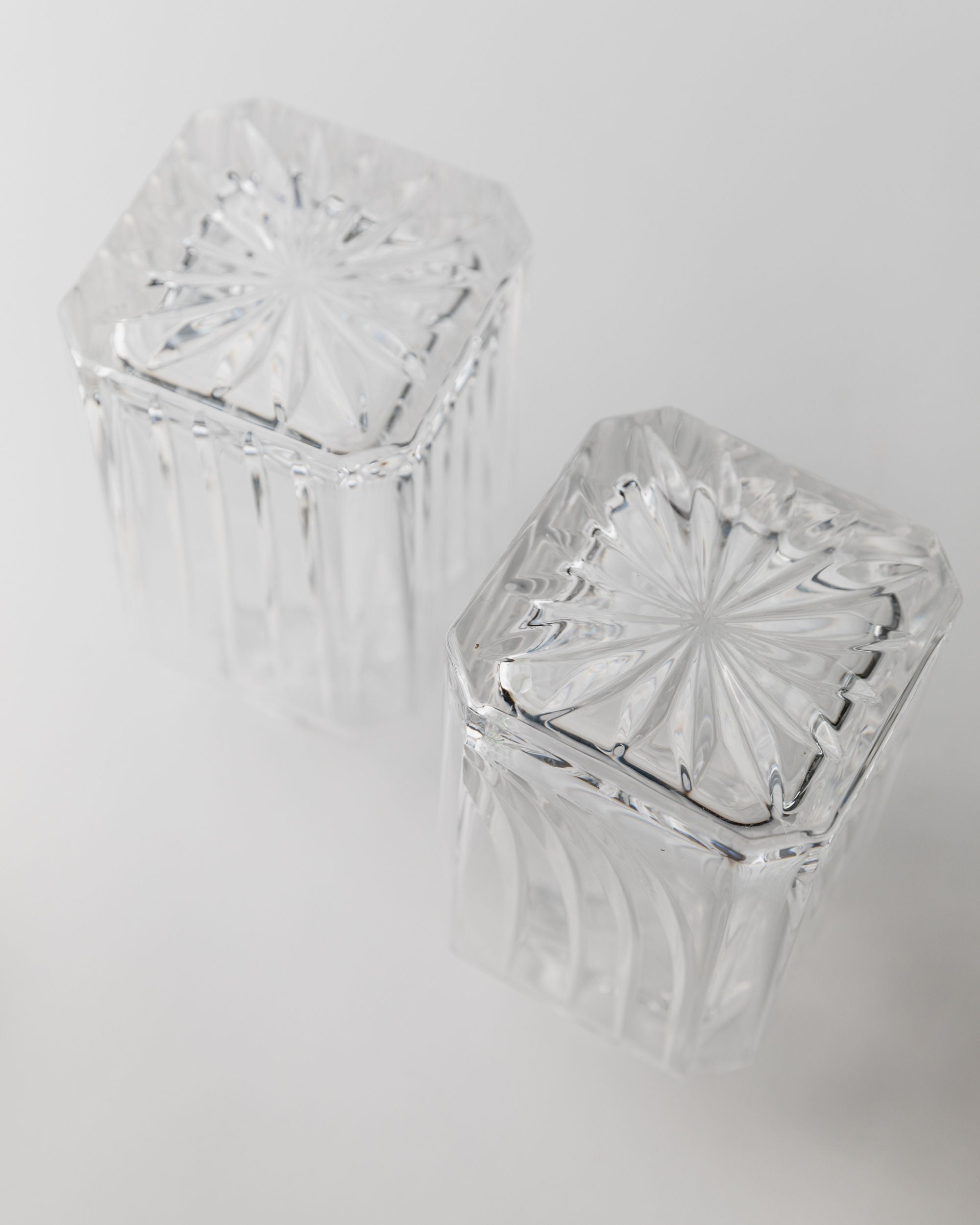 Crystal glass decanters with sunburst pattern lids, Italian 1950s