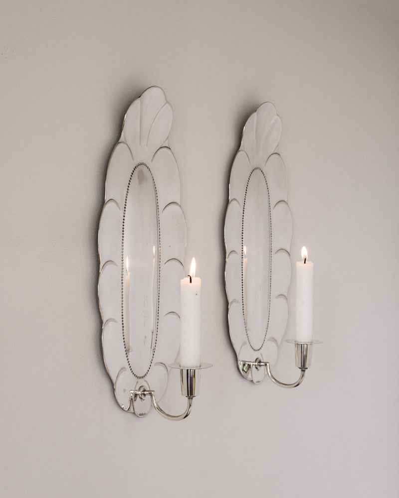 Pair of 1930s silver scalloped shell wall sconces with lit candles