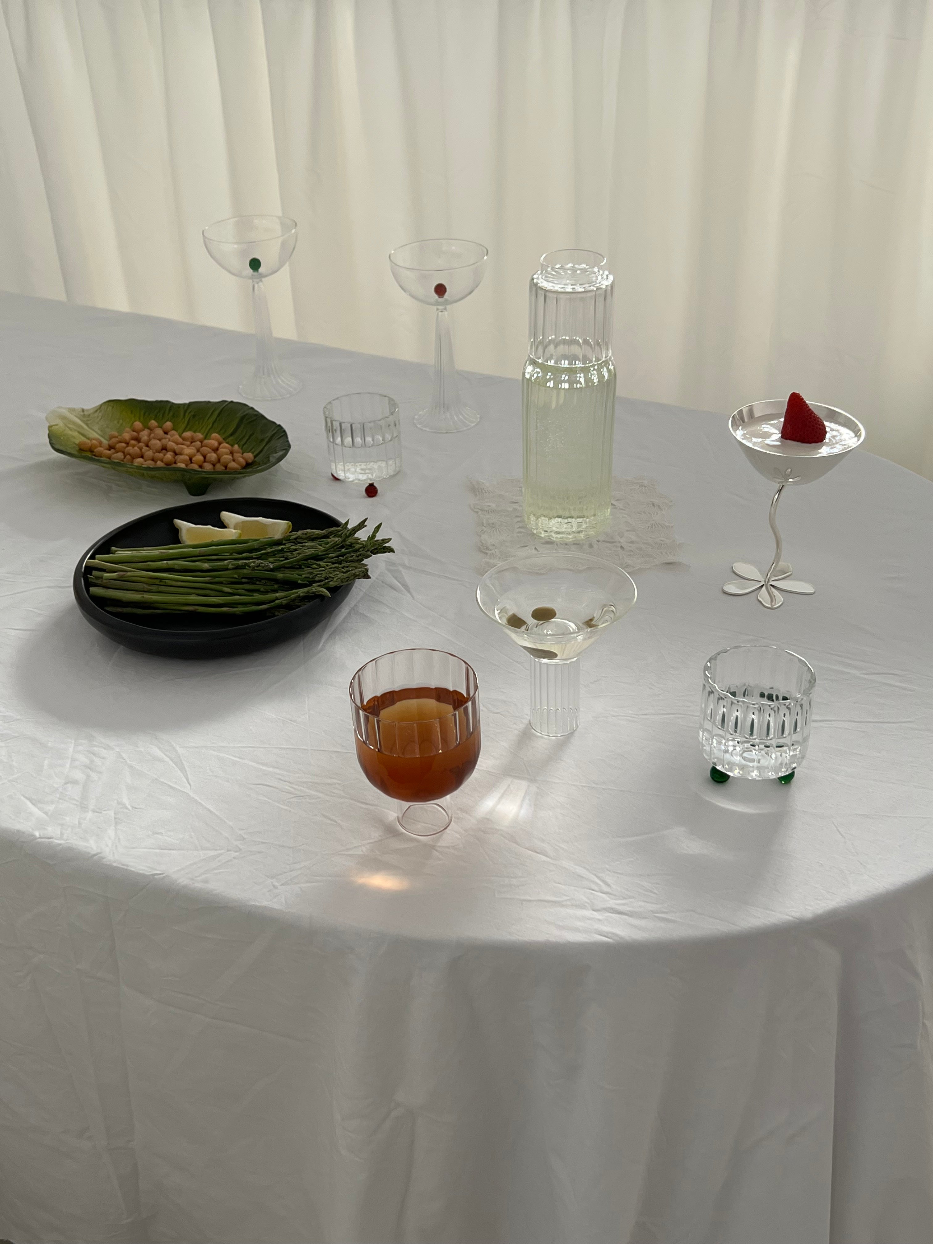 High Spirits — Lowball Glass Green — close-up on white table setting