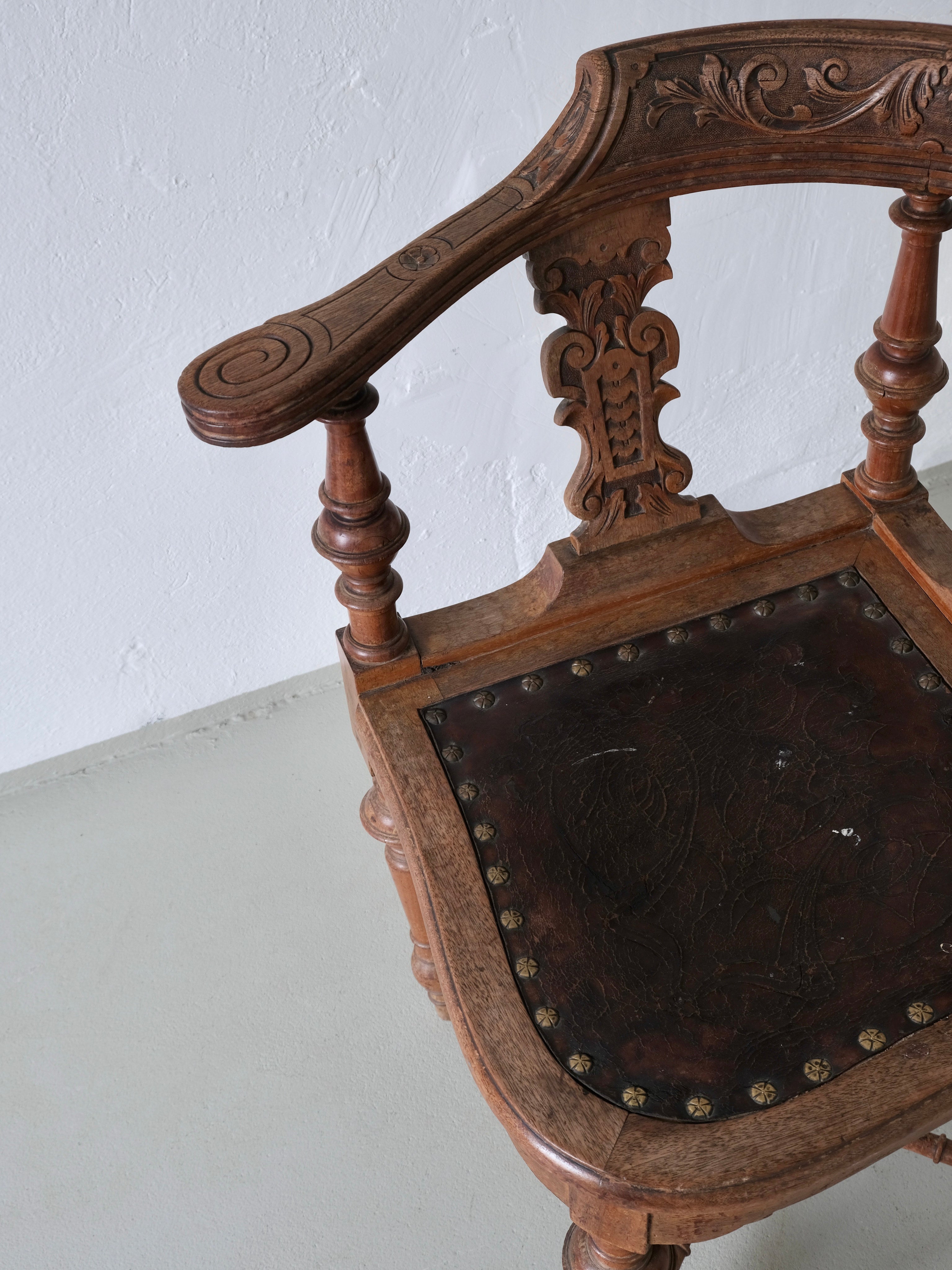 Antique Carved Corner Chair with Leather Seat