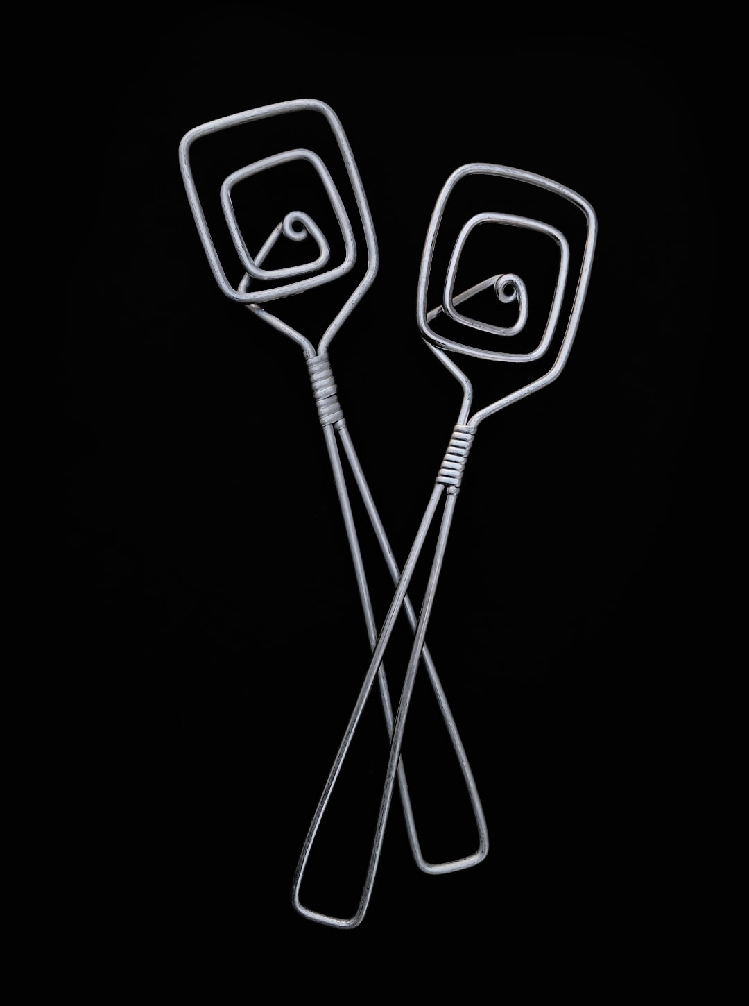 80's Salad Servers — angled view of silver metal cutlery