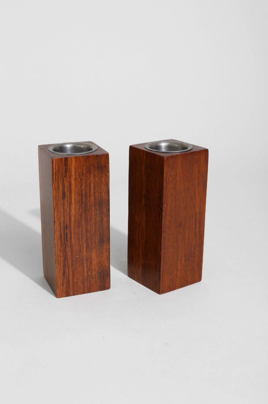 Pair of walnut wood block candleholders with metal inserts