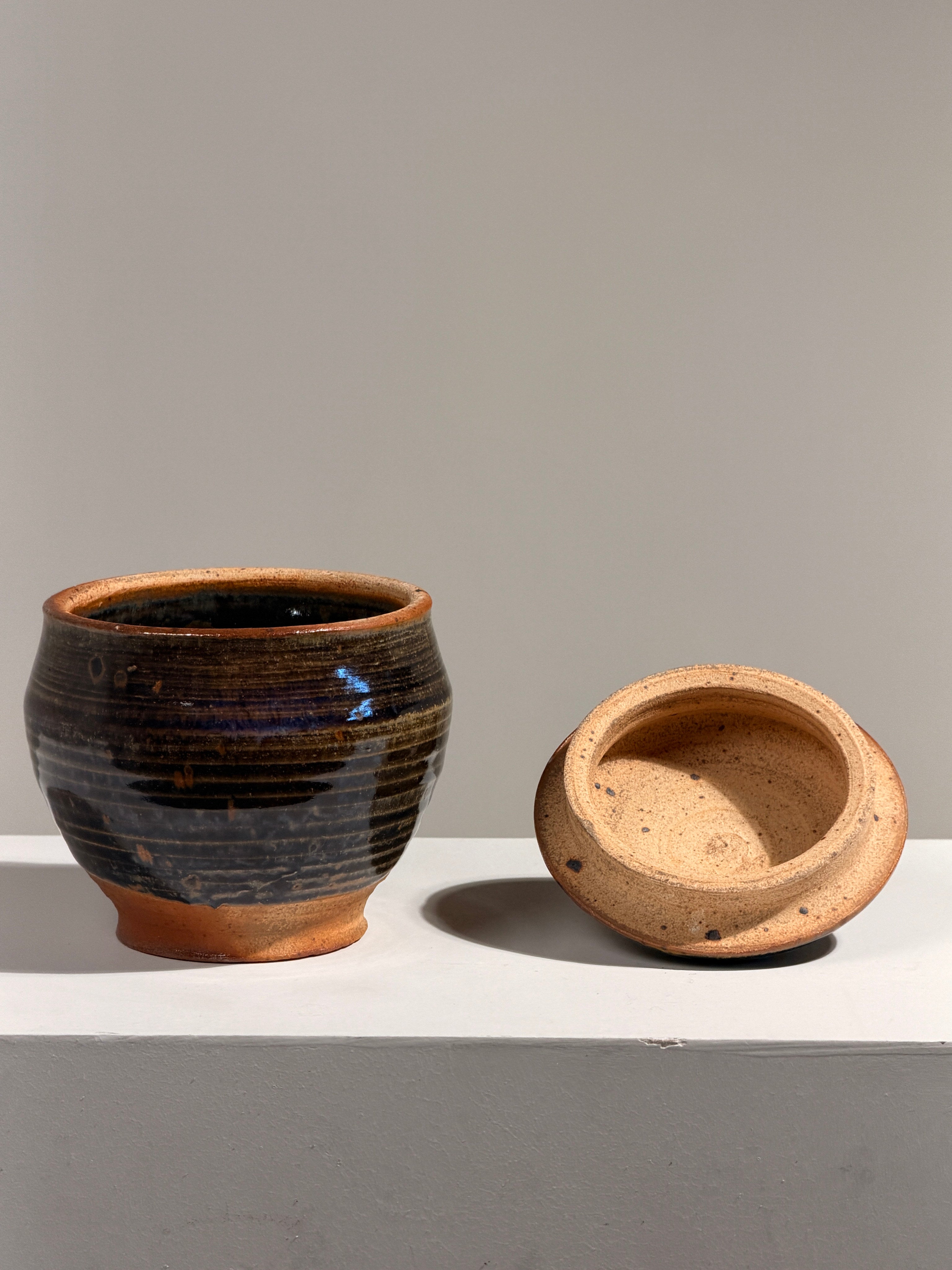 Covered stoneware pot, France, circa 1960 — lifestyle setting
