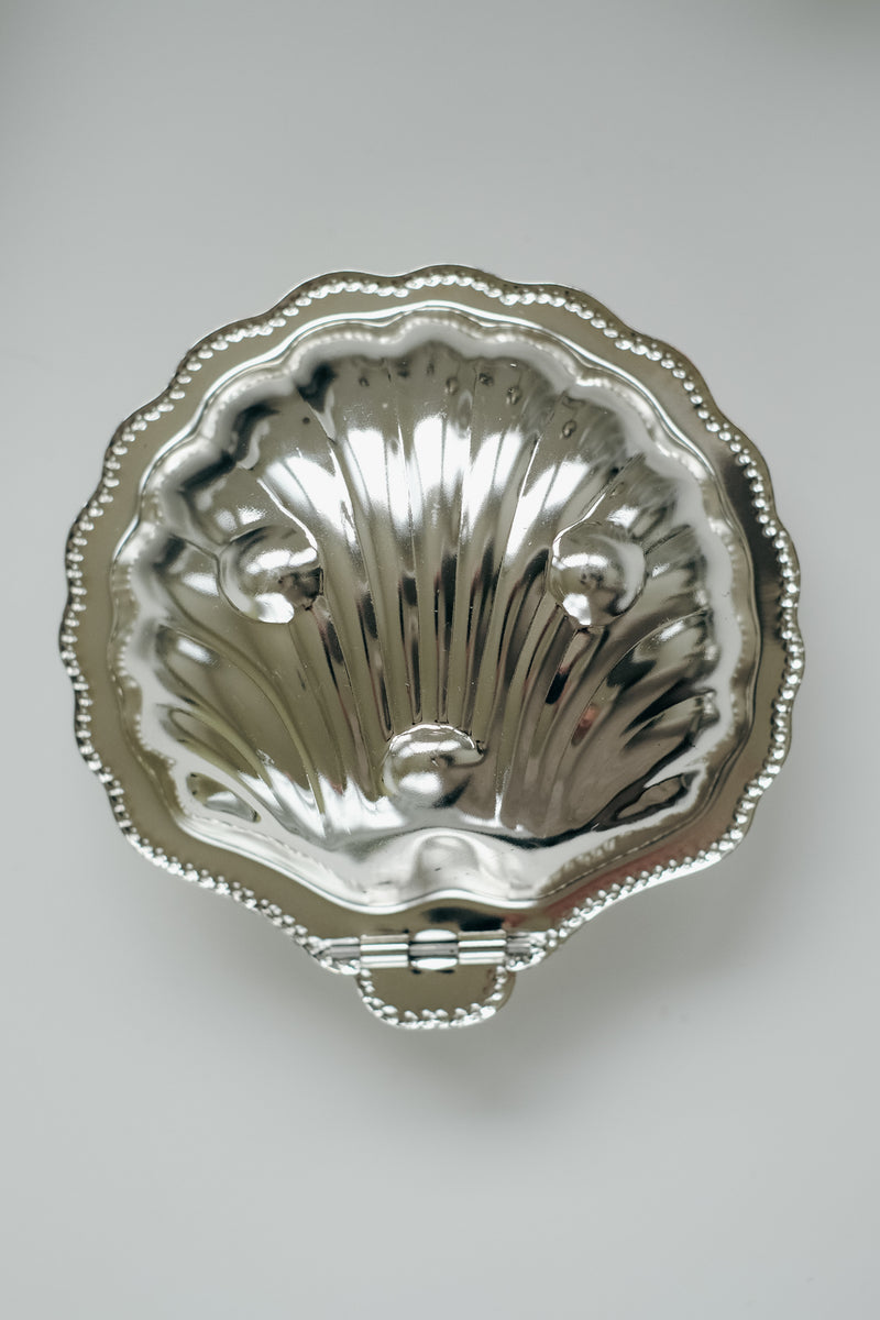 Shell Shaped Butter Dish — top view of polished metal surface