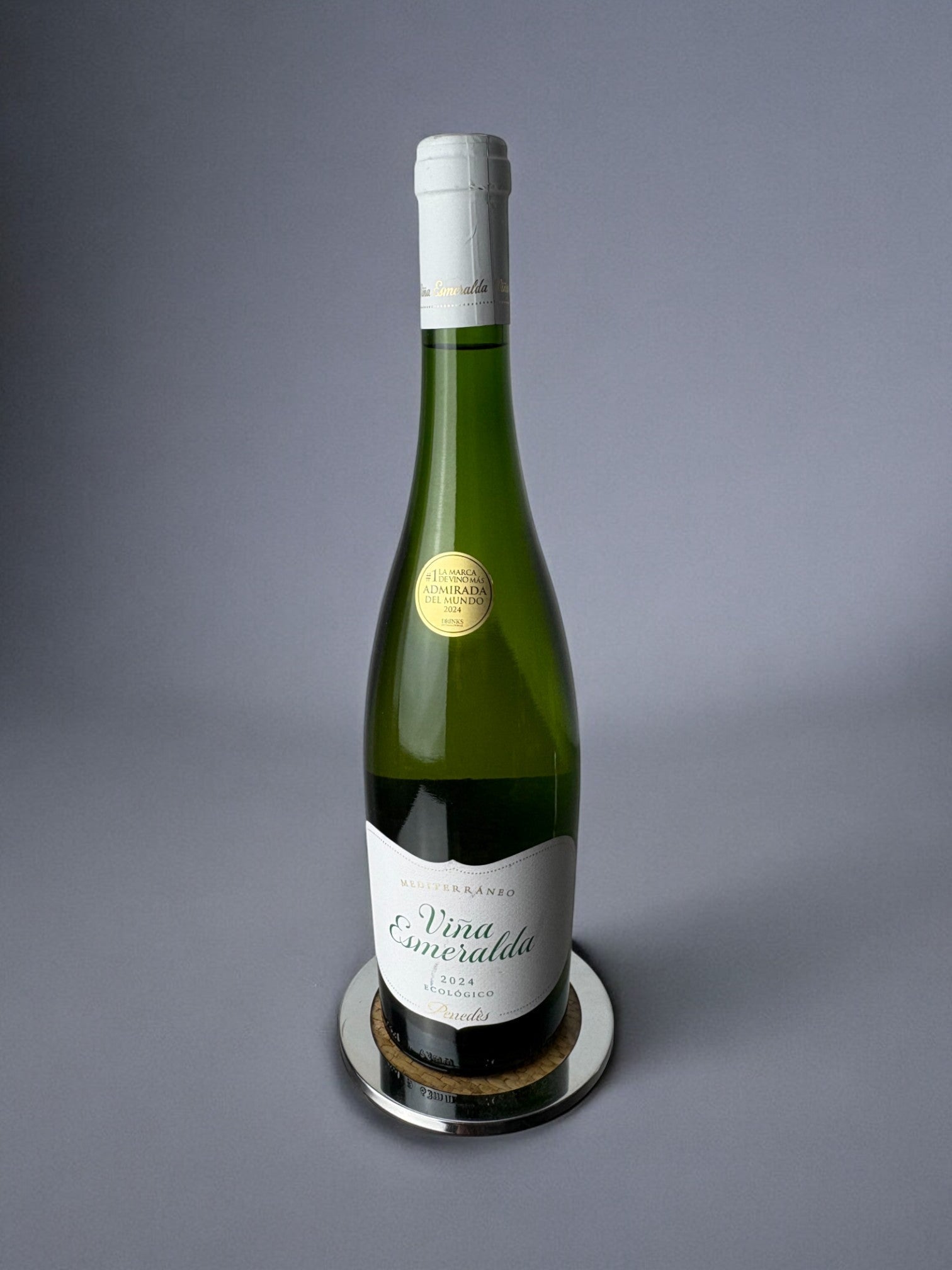 Christian Dior Style Lucite & Rattan Bottle Coaster, Italy, 1970's — bottle resting on reflective lucite base