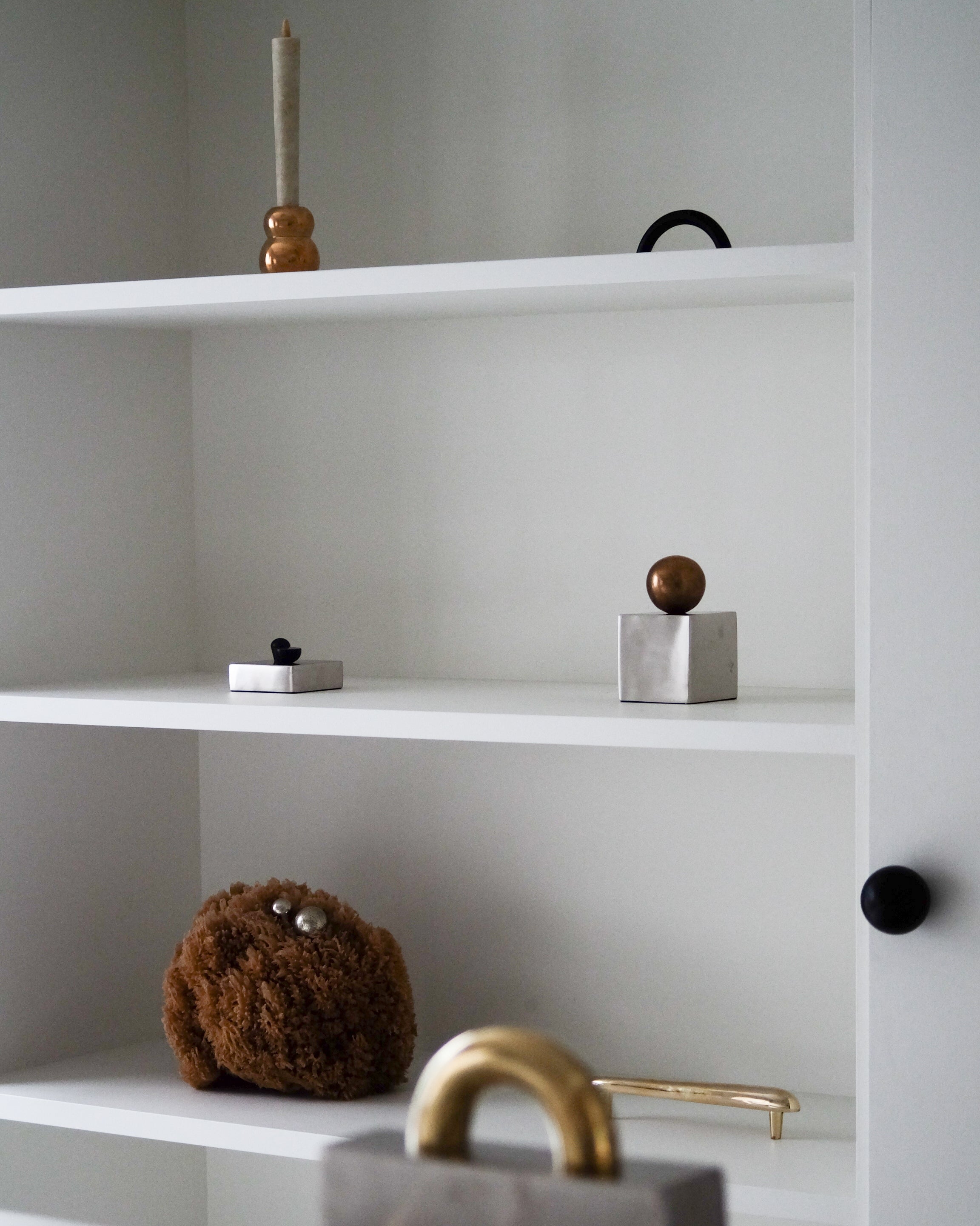 CERCLE Cabinet Pull Thin (2 sizes) — back view on white shelf with decor