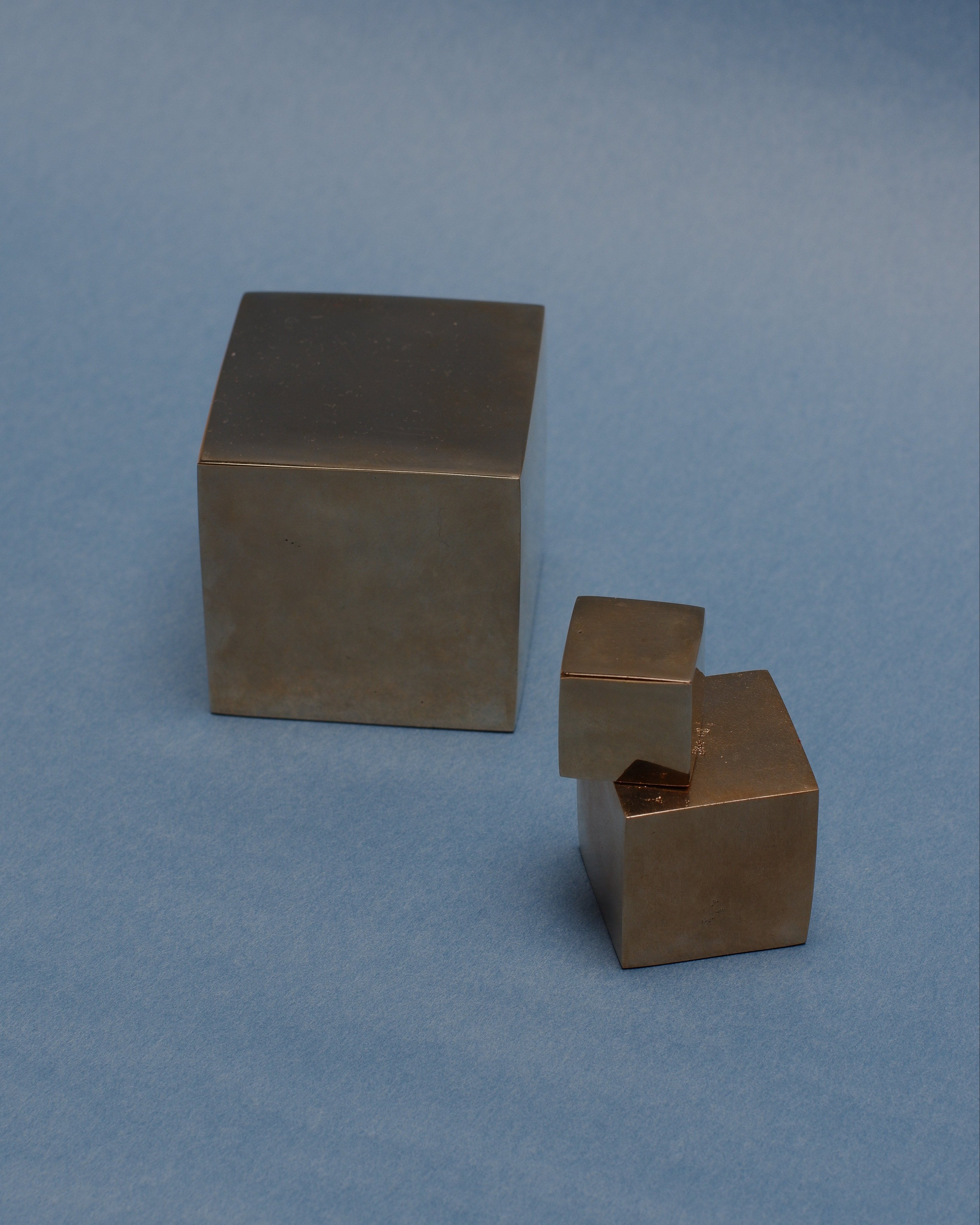 CUBE Cabinet Knob Small — angled view on blue background