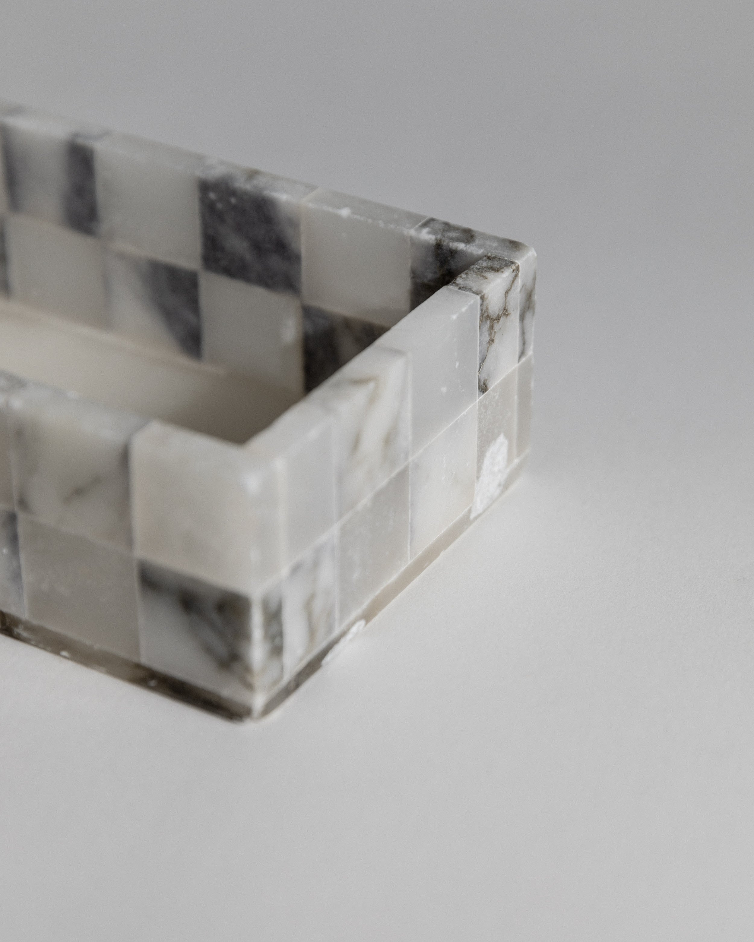 Close-up detail of 1970s marble smoking set geometric edges