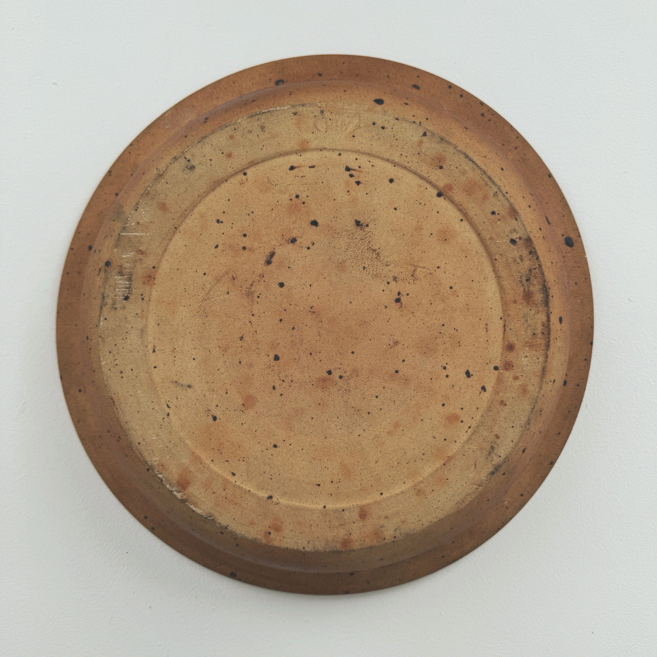 Bottom view of large stoneware bowl by Pierre Digan showing base
