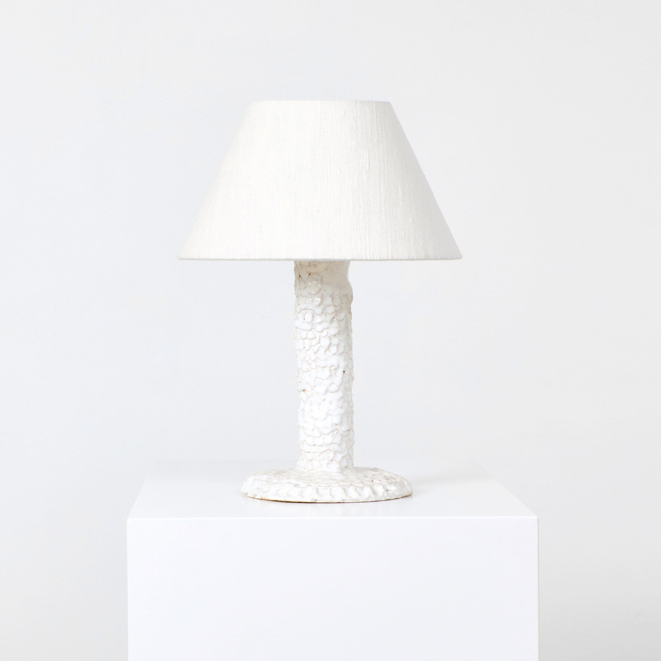 Casa Bedside Light — close-up of textured white ceramic base