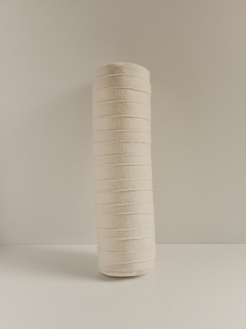 Textured wool bolster cushion by Elle La | The Oblist