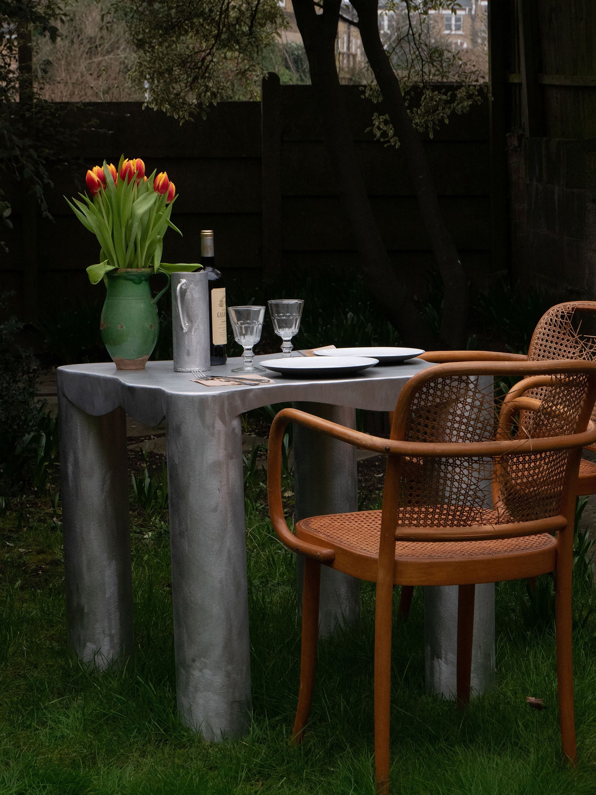 Aluminum Dining Table — back view in garden setting with chairs