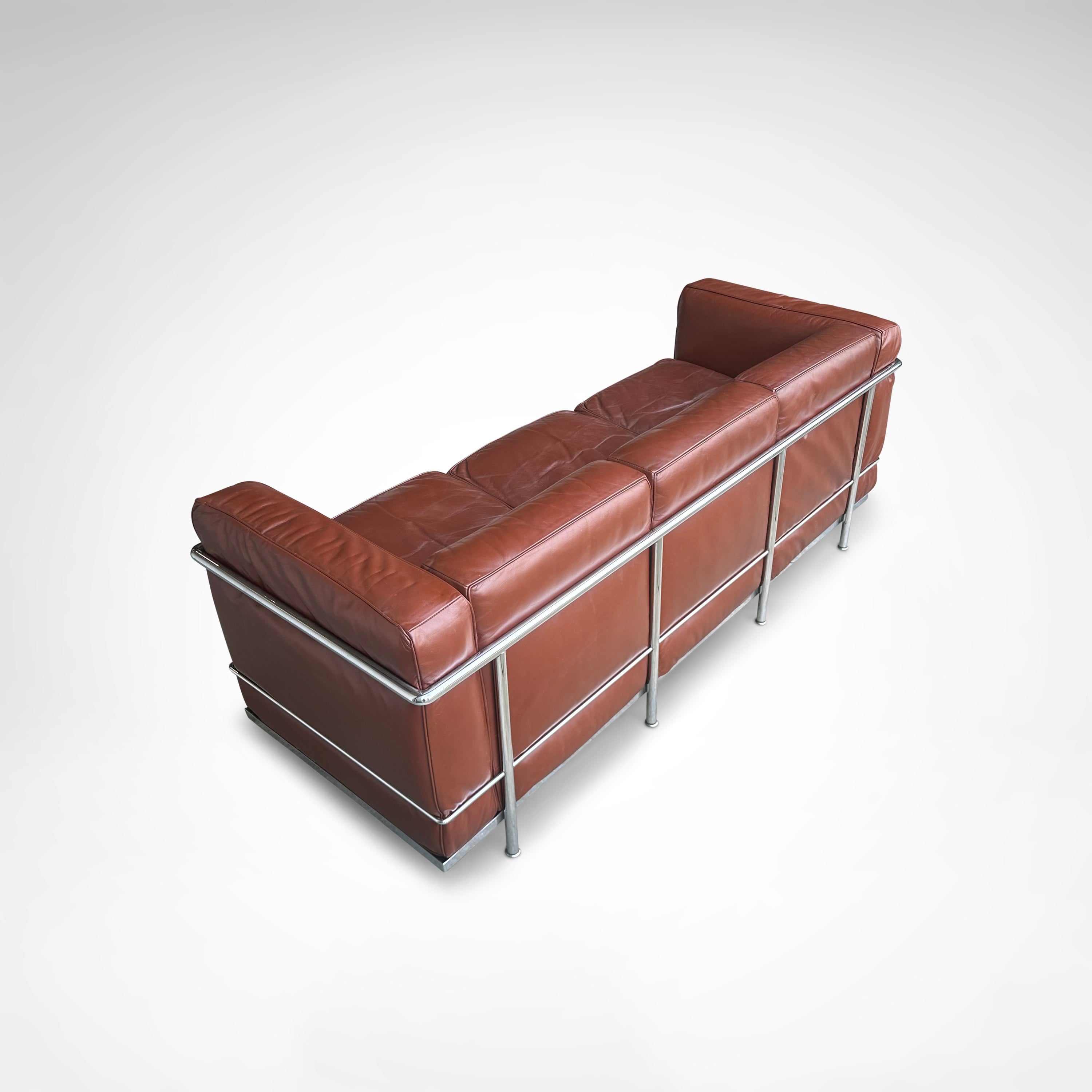Early production LC2 leather 3-seater sofa by Le Corbusier et al Cassina 1970s — rear view highlighting rich brown leather up