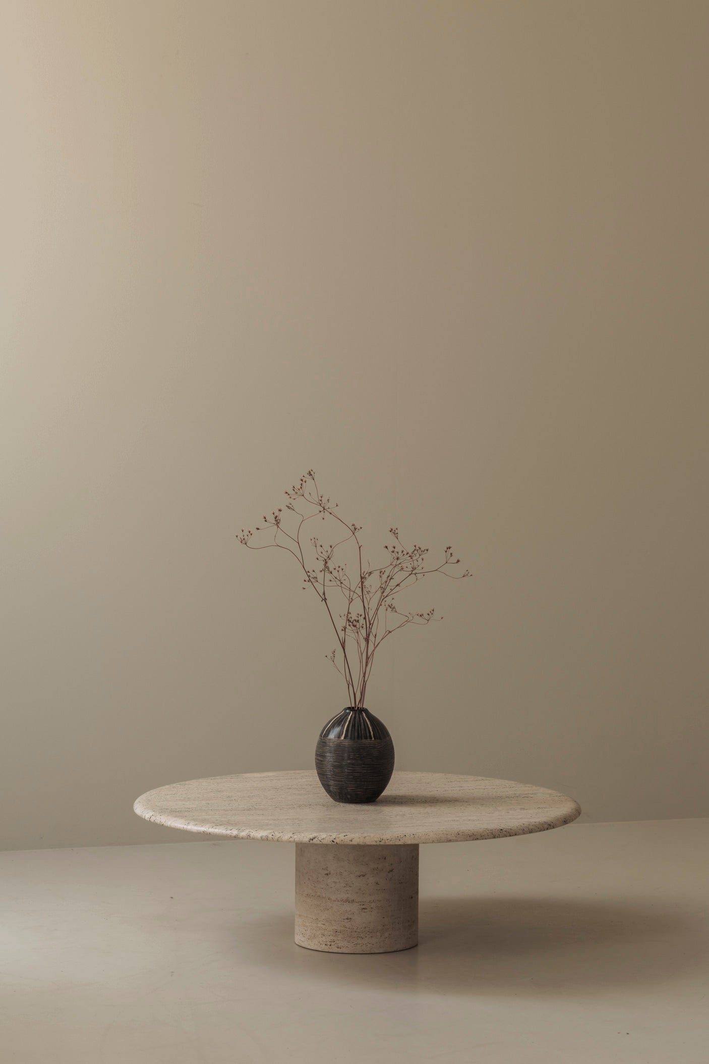 Travertine round coffee table by Angelo Mangiarotti, Italy 1970s — side angle