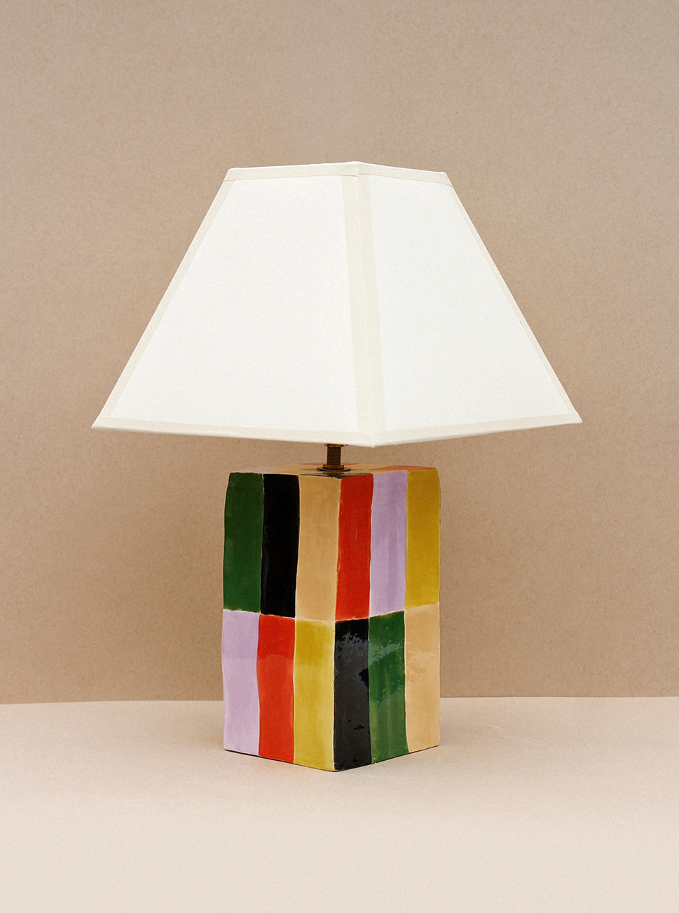 Milagro Lamp (Grande) — angled view of colorful ceramic base