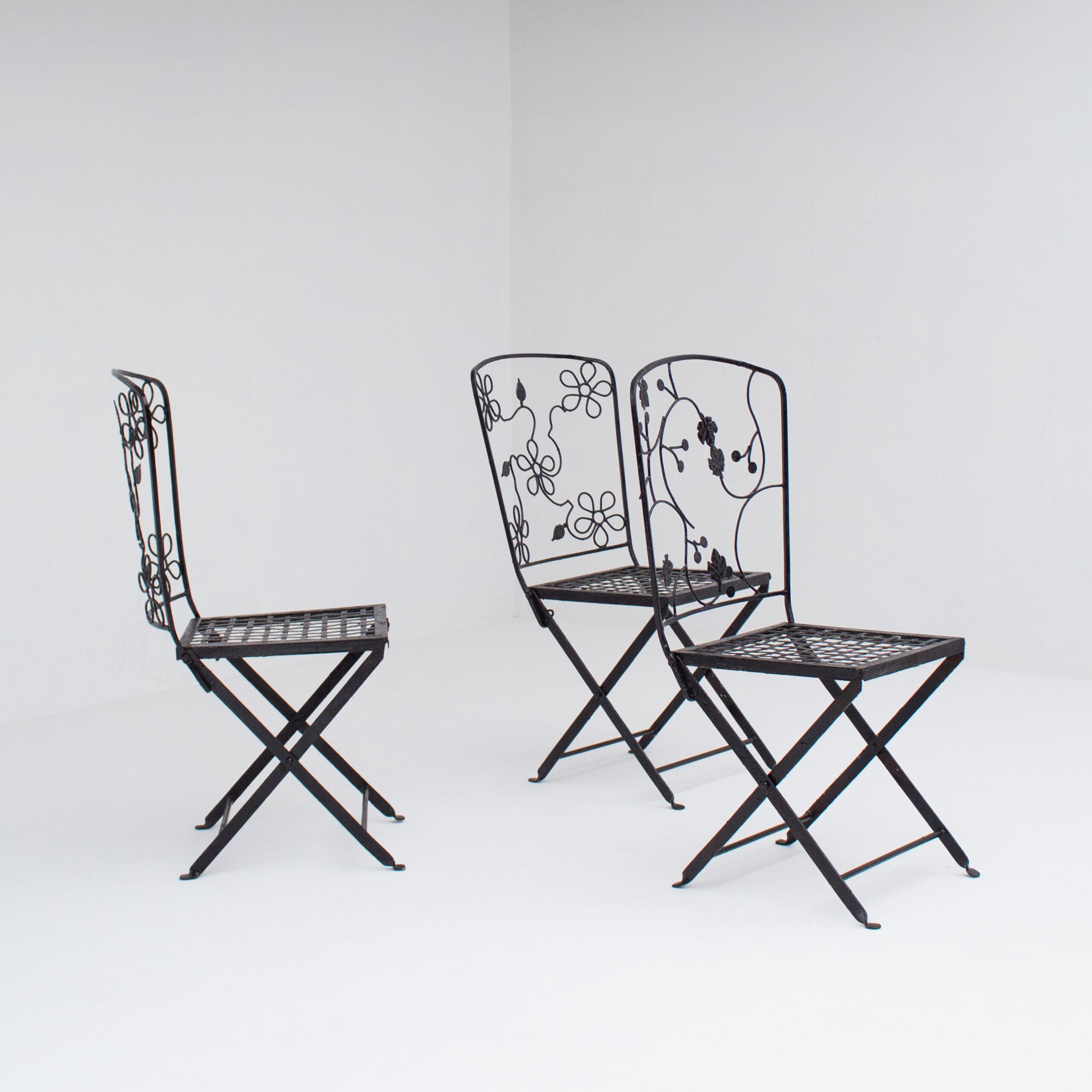 Set of Three Decorative Wrought Iron Garden Chairs with Floral Backrests — detail view