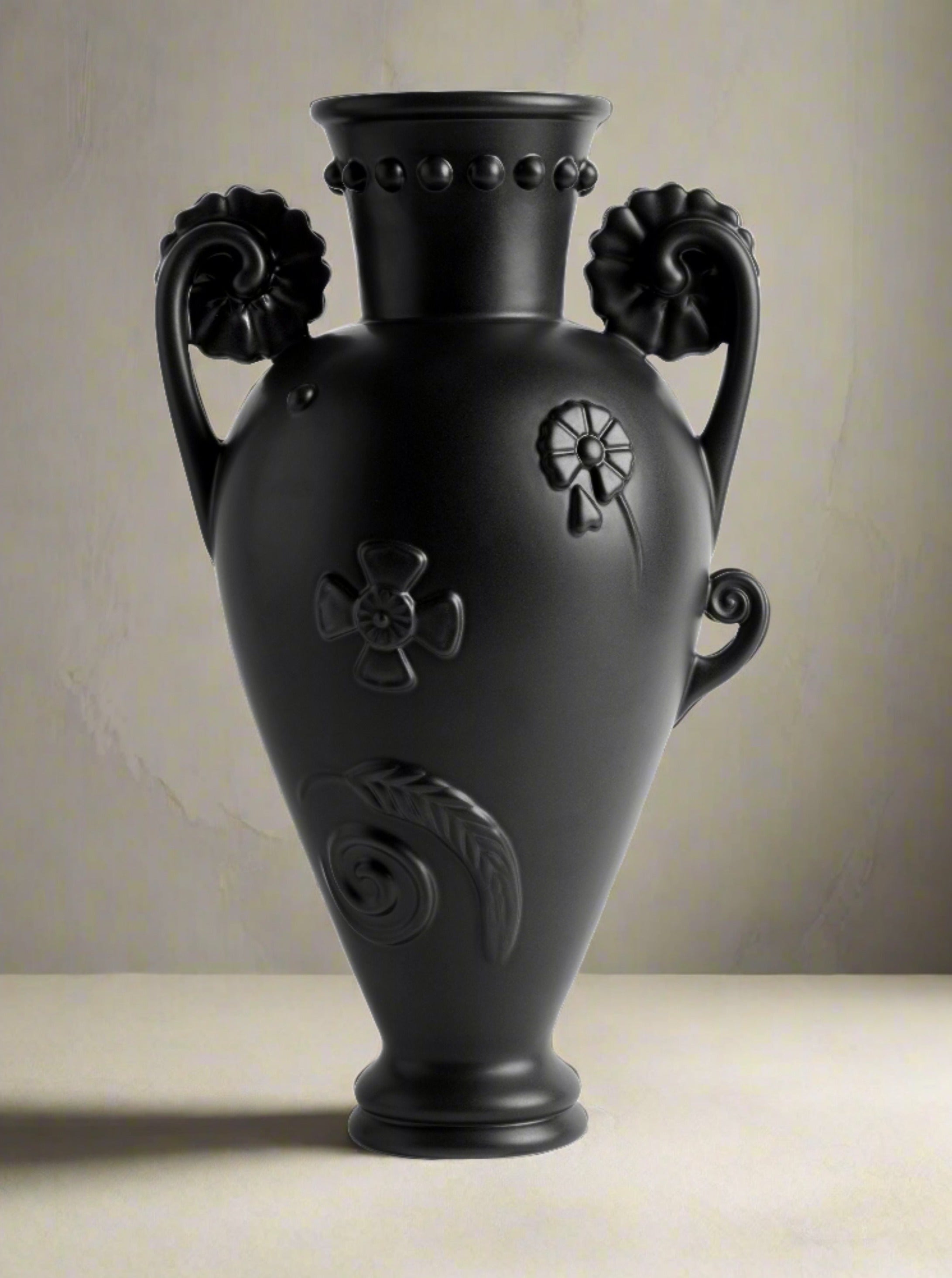 Black Earthenware Vase — side angle showing detailed floral reliefs