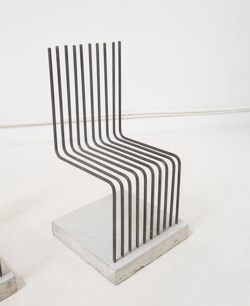 Postmodern chair with curved metal rods forming seat and backrest