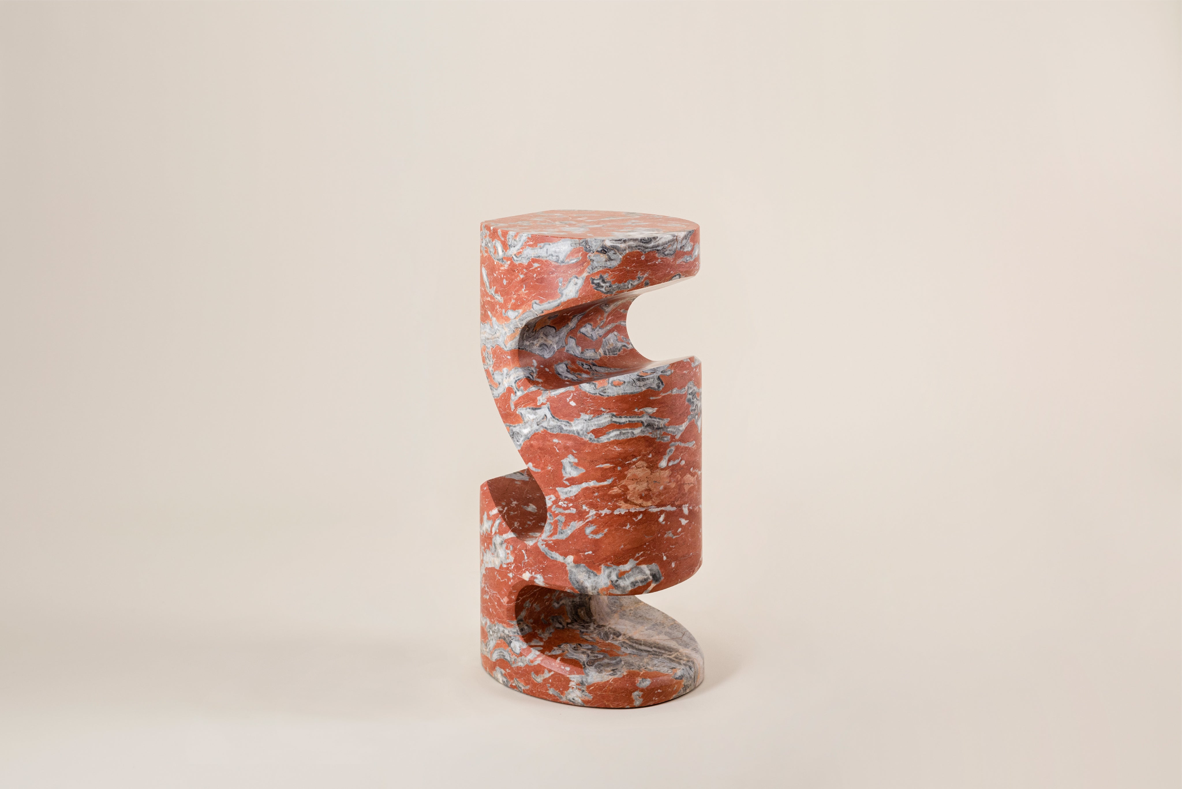 Tobo Side Table — angled view of red marble design